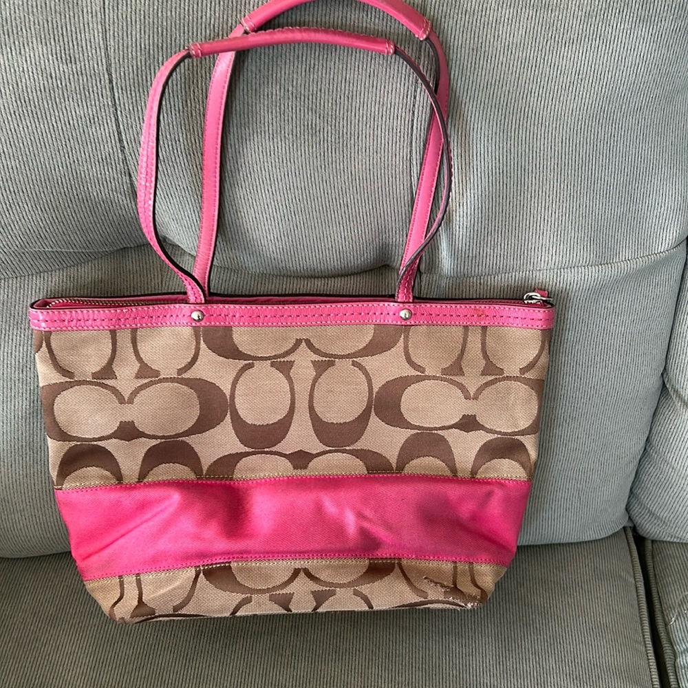 Coach Tan Purse with Pink Leather Straps.  Pink stripe accent.